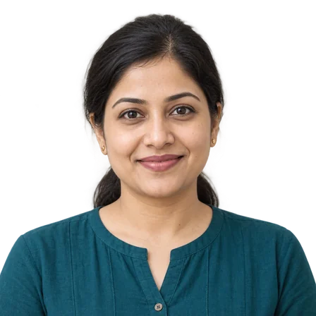 A woman smiling at the camera, head and shoulders.
